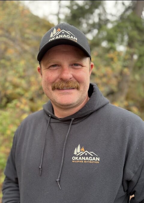 justin-zimmerman-fire-mitigation Portrait of Justin Zimmerman wearing Okanagan Wildfire Mitigation clothing.